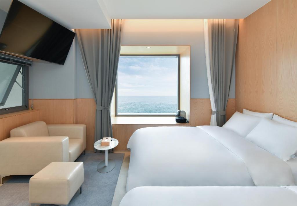 Postel nebo postele na pokoji v ubytování Frux Flux hotel