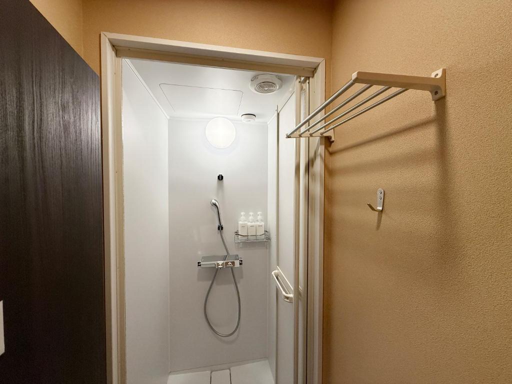 Koupelna v ubytování Budget Room JINYA