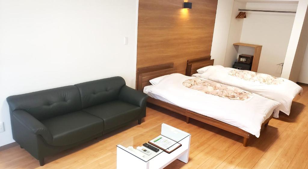 Postel nebo postele na pokoji v ubytování Tokiwaya