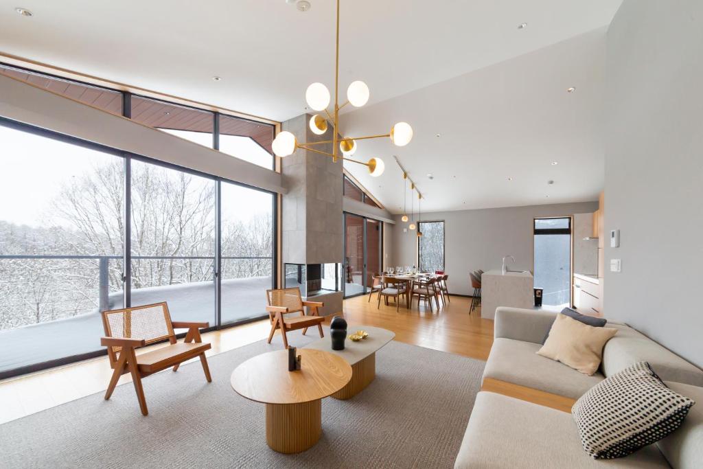 a living room with a couch and a table at Mori Casa in Kutchan