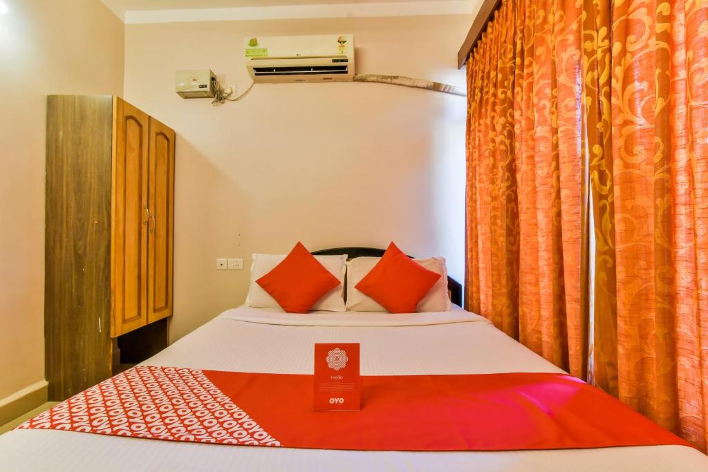 Postel nebo postele na pokoji v ubytování Hotel O 4 Pillar's Near Immaculate Conception Church