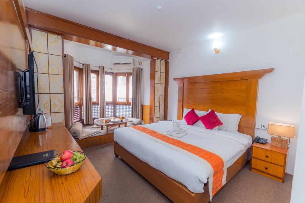 Postel nebo postele na pokoji v ubytování Amber Royel Hotel