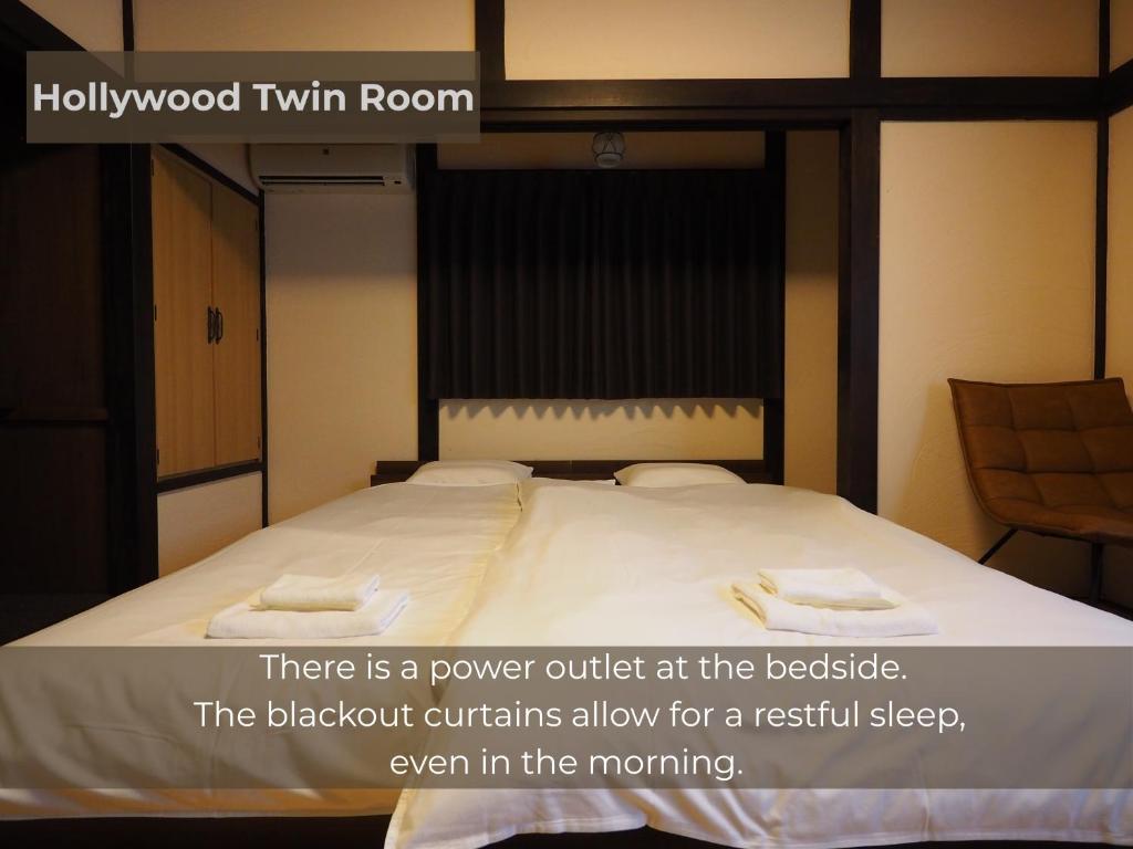 Postel nebo postele na pokoji v ubytování BUNA KUSATSU Onsen Inn