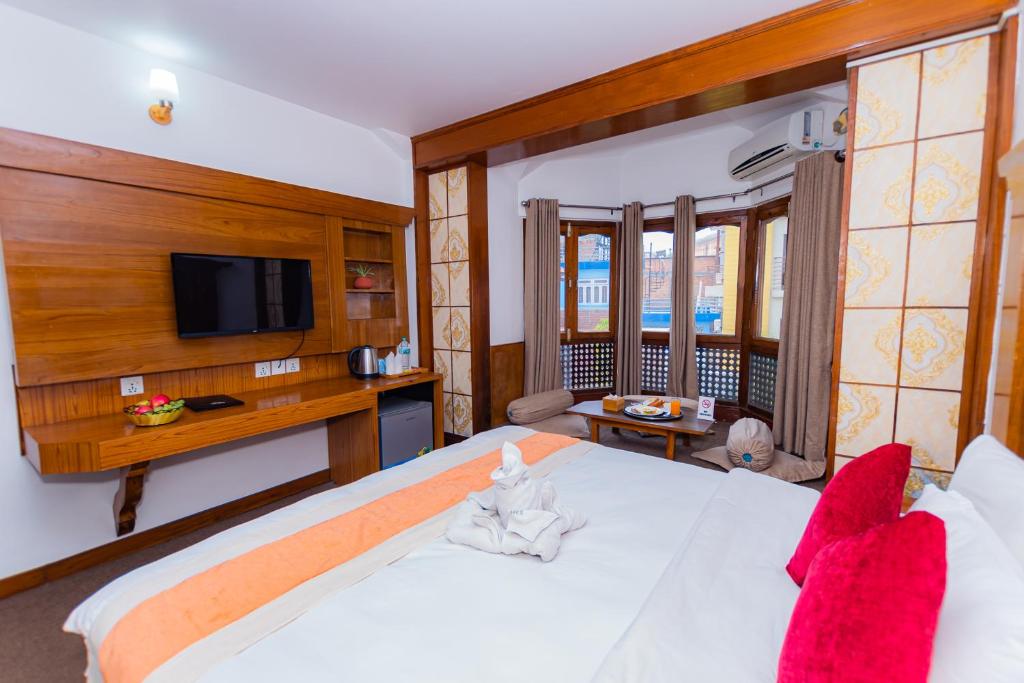 Postel nebo postele na pokoji v ubytování Amber Royel Hotel