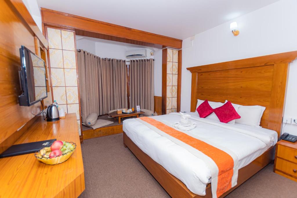 Postel nebo postele na pokoji v ubytování Amber Royel Hotel