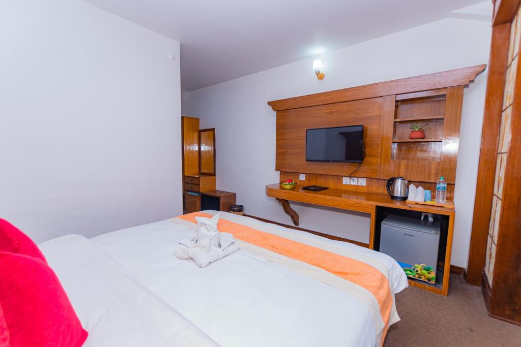TV a/nebo společenská místnost v ubytování Amber Royel Hotel