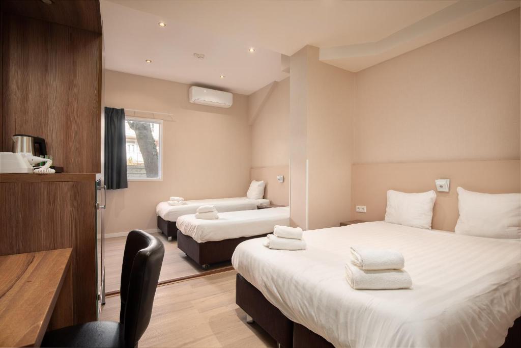 Postel nebo postele na pokoji v ubytování Hotel Victorie