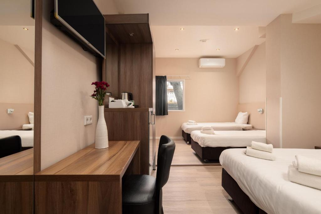 Postel nebo postele na pokoji v ubytování Hotel Victorie
