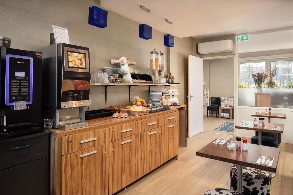 Kuchyň nebo kuchyňský kout v ubytování Hotel Victorie