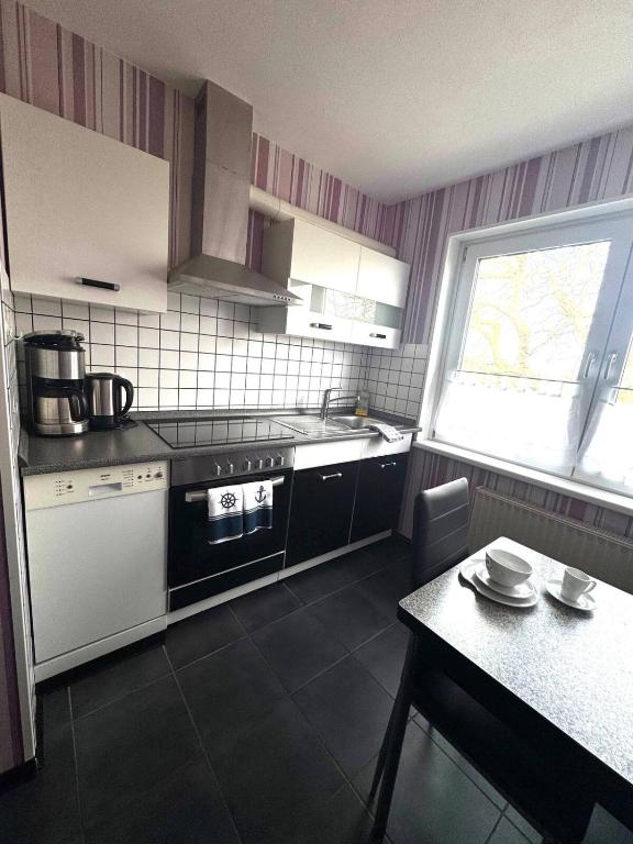 Kuchyň nebo kuchyňský kout v ubytování Ostsee Pension Pohnsdorfer Mühle