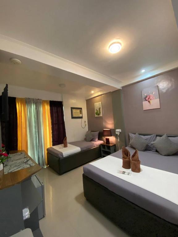 Postel nebo postele na pokoji v ubytování Elena's Suite El Nido