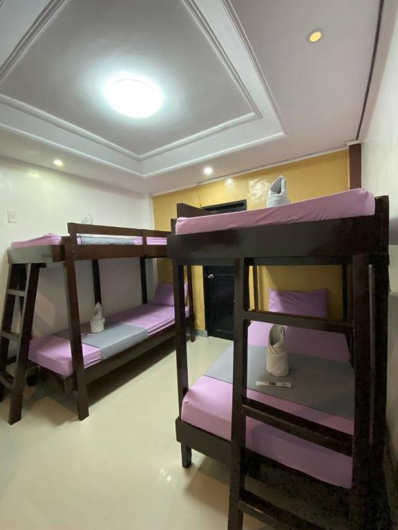 Postel nebo postele na pokoji v ubytování Elena's Suite El Nido