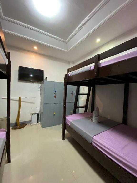 Postel nebo postele na pokoji v ubytování Elena's Suite El Nido