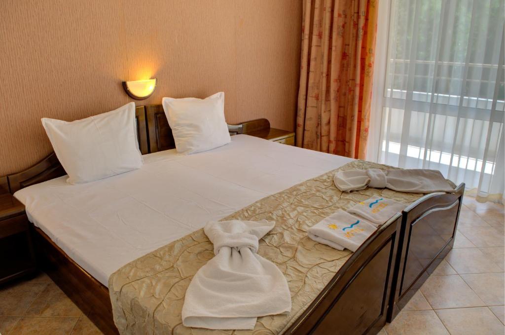 Postel nebo postele na pokoji v ubytování Hotel Feniks Lozenets