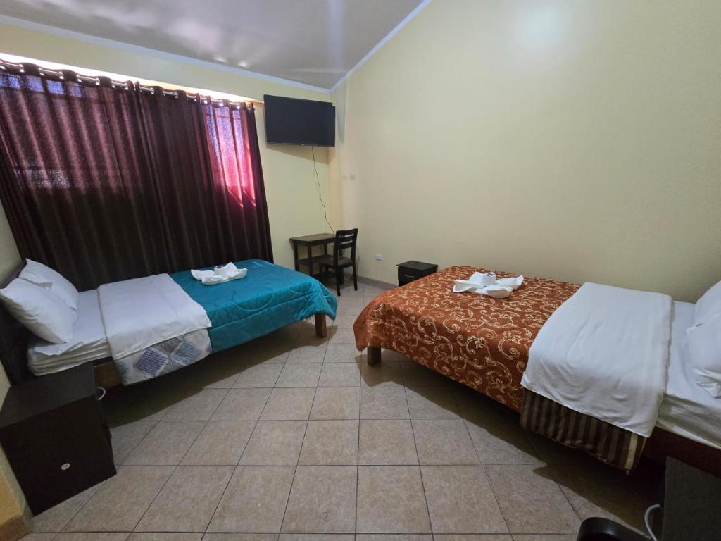 Postel nebo postele na pokoji v ubytování HOSPEDAJE DONA Ayacucho
