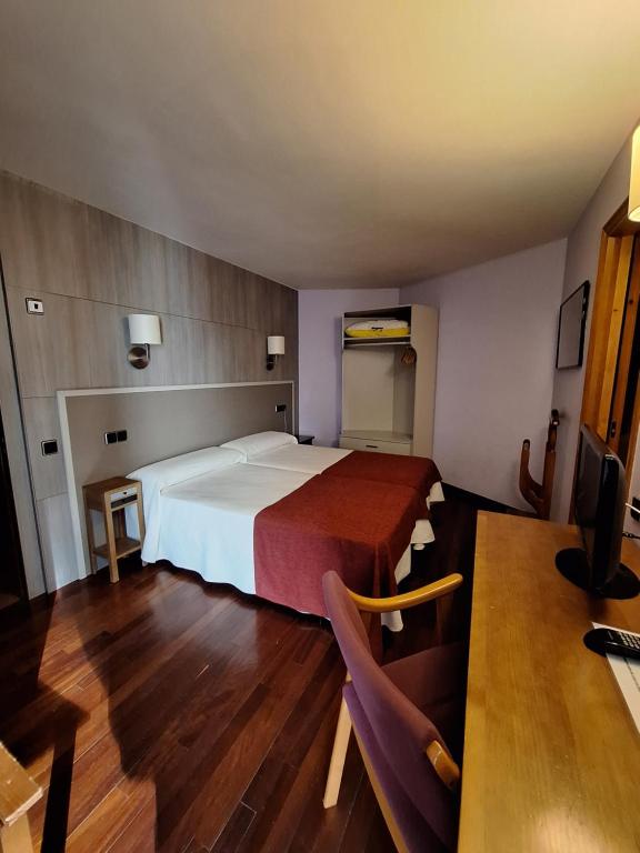 Postel nebo postele na pokoji v ubytování Hotel Aragüells