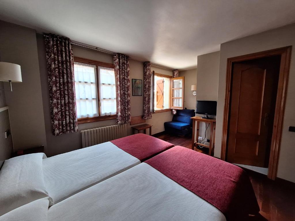 Postel nebo postele na pokoji v ubytování Hotel Aragüells