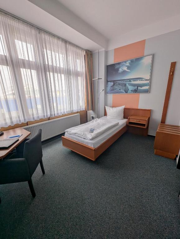 Postel nebo postele na pokoji v ubytování DLRG Tagungszentrum Hotel Delphin