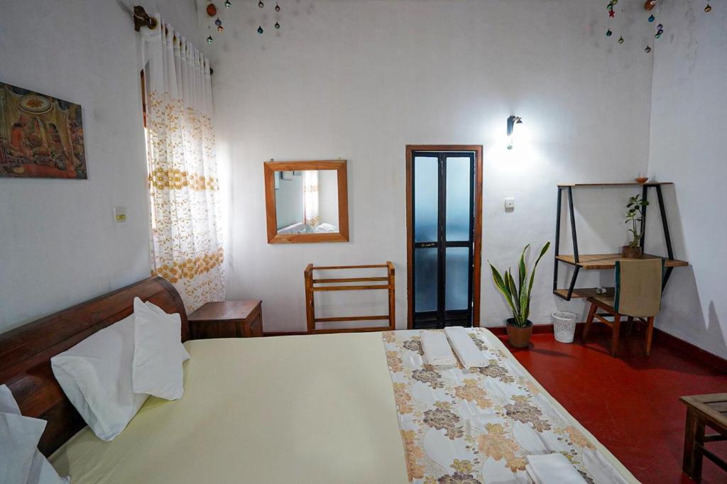 Postel nebo postele na pokoji v ubytování 4ty two Homestay Galle