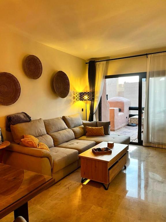 a living room with a couch and a coffee table at Sweet Home II in Manilva