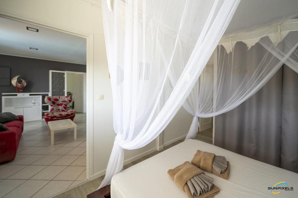 Posezení v ubytování Villa An ti kwen paradi 3 chambres avec piscine et vue mer