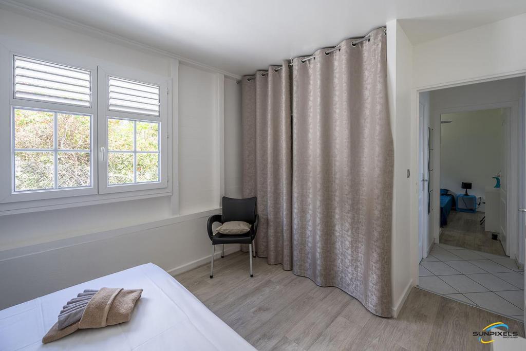 Postel nebo postele na pokoji v ubytování Villa An ti kwen paradi 3 chambres avec piscine et vue mer