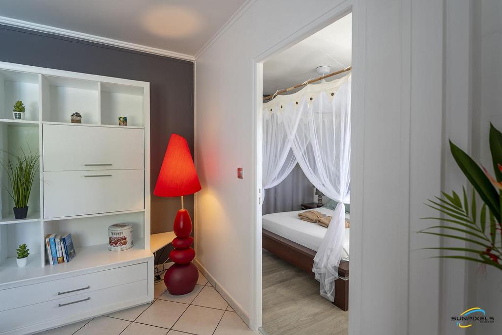 Postel nebo postele na pokoji v ubytování Villa An ti kwen paradi 3 chambres avec piscine et vue mer