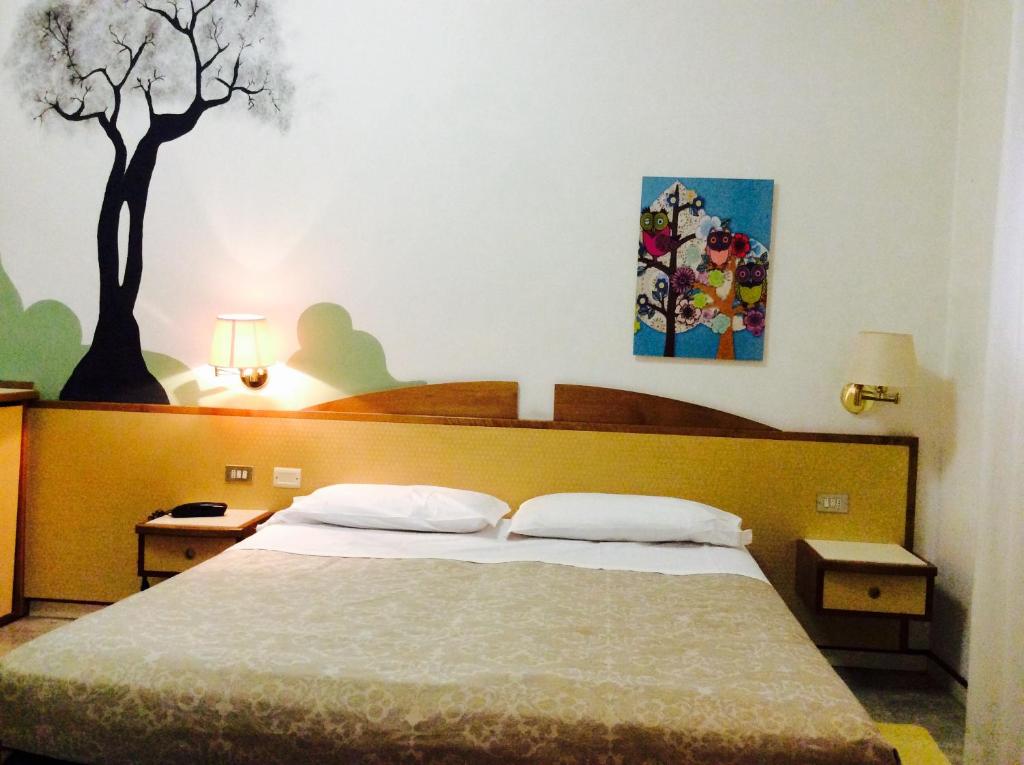 Postel nebo postele na pokoji v ubytování Hotel Alexandra