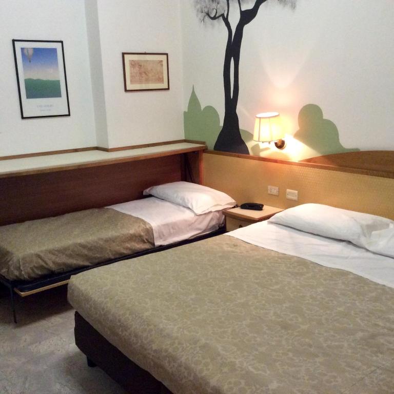 Postel nebo postele na pokoji v ubytování Hotel Alexandra