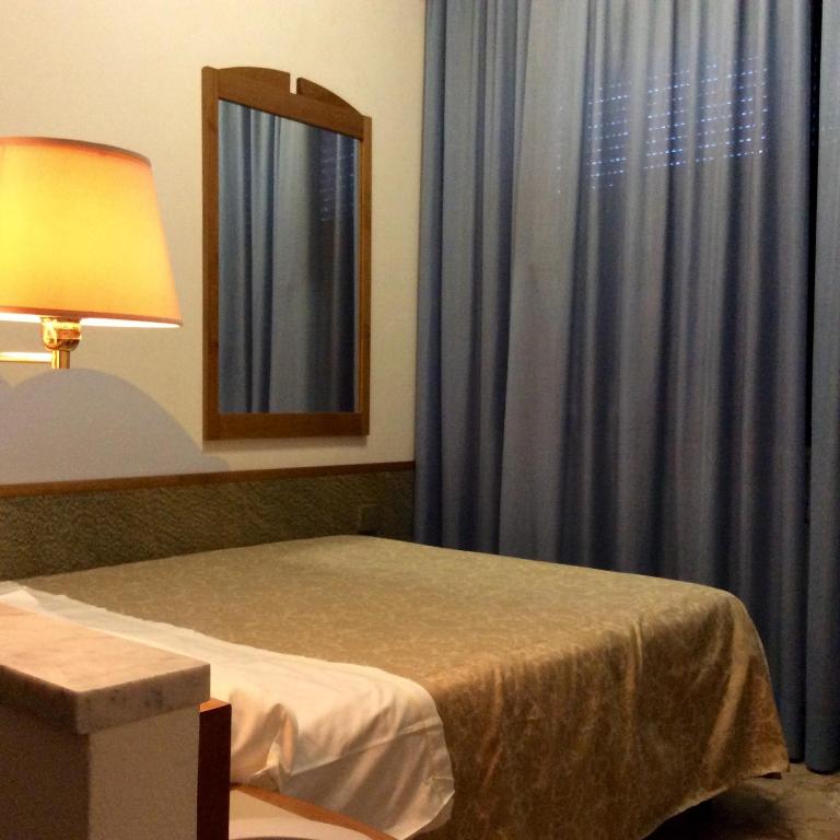 Postel nebo postele na pokoji v ubytování Hotel Alexandra