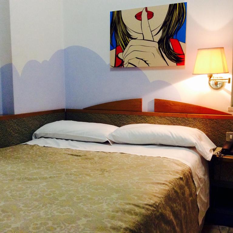Postel nebo postele na pokoji v ubytování Hotel Alexandra