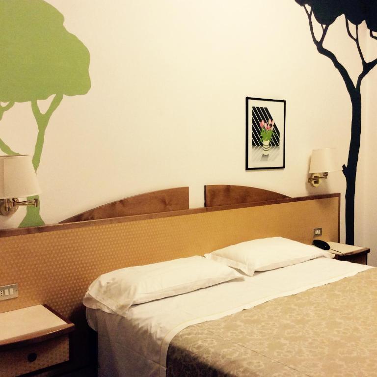 Postel nebo postele na pokoji v ubytování Hotel Alexandra