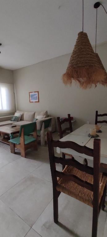 a living room with a couch and a table at Casa Bella vista in Paysandú