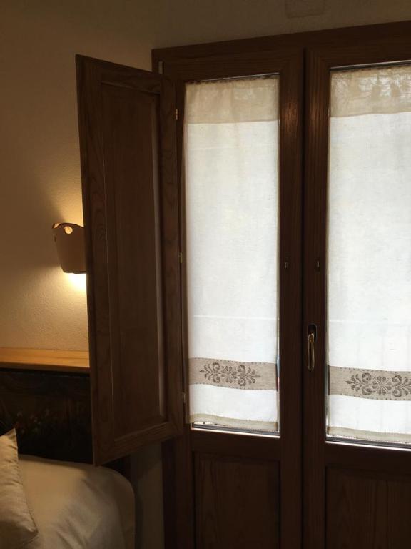 Postel nebo postele na pokoji v ubytování Agriturismo S'Orgiola