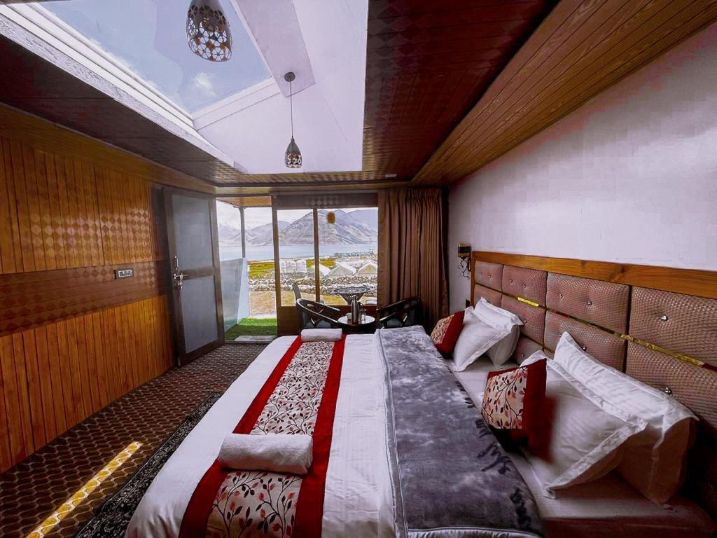 Postel nebo postele na pokoji v ubytování Star Quest Cottages, Pangong