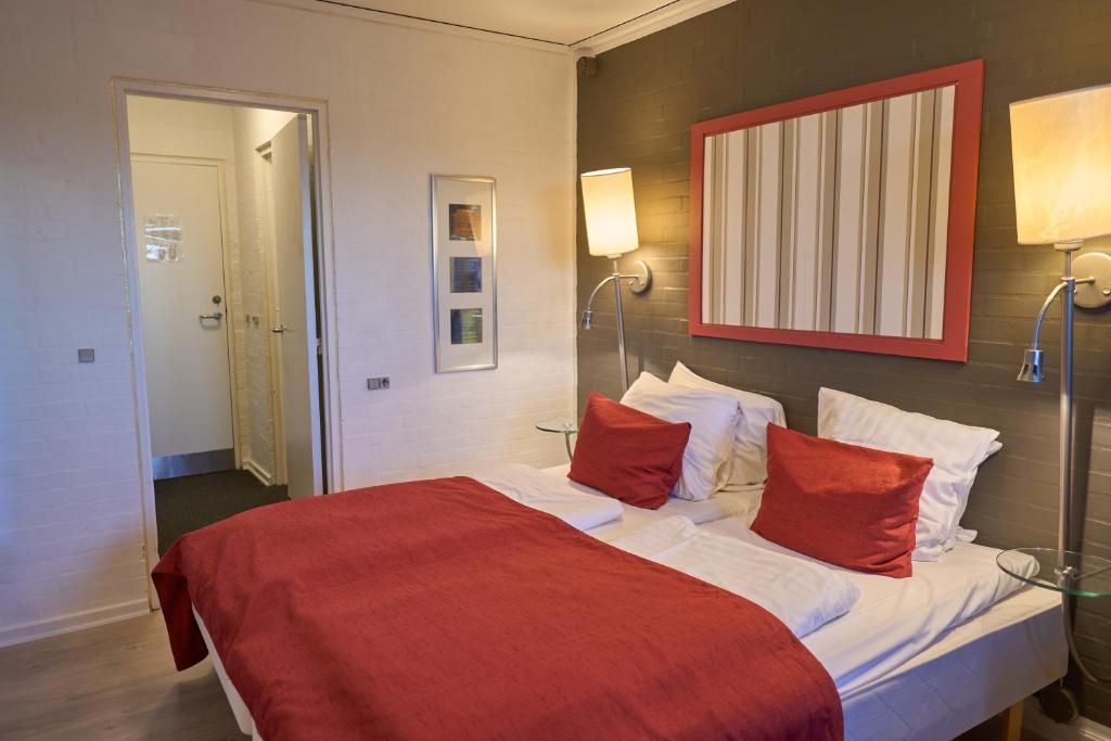 Postel nebo postele na pokoji v ubytování Hotel Fanø