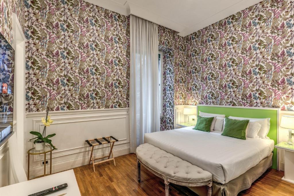 Postel nebo postele na pokoji v ubytování Mangili Garden Hotel