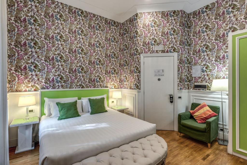 Postel nebo postele na pokoji v ubytování Mangili Garden Hotel