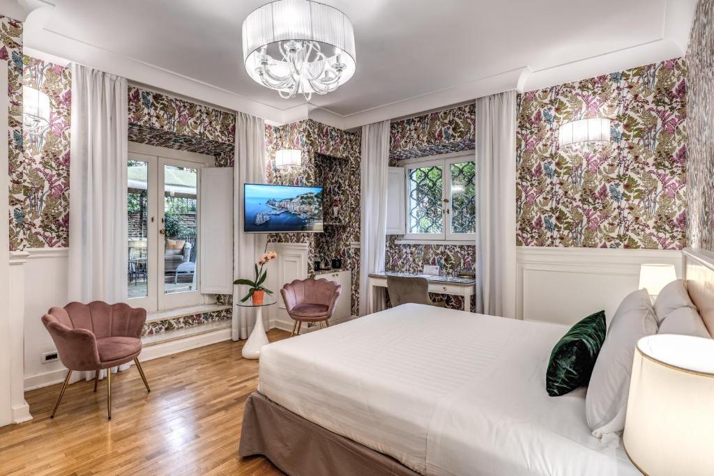 TV a/nebo společenská místnost v ubytování Mangili Garden Hotel