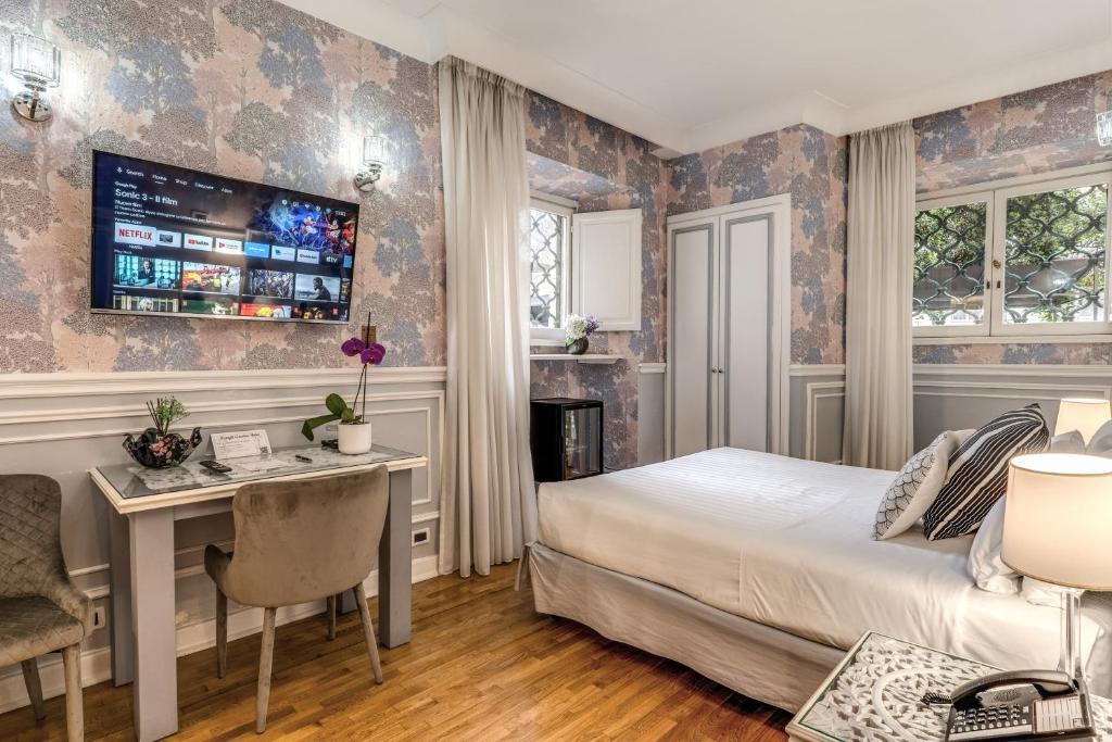 Postel nebo postele na pokoji v ubytování Mangili Garden Hotel