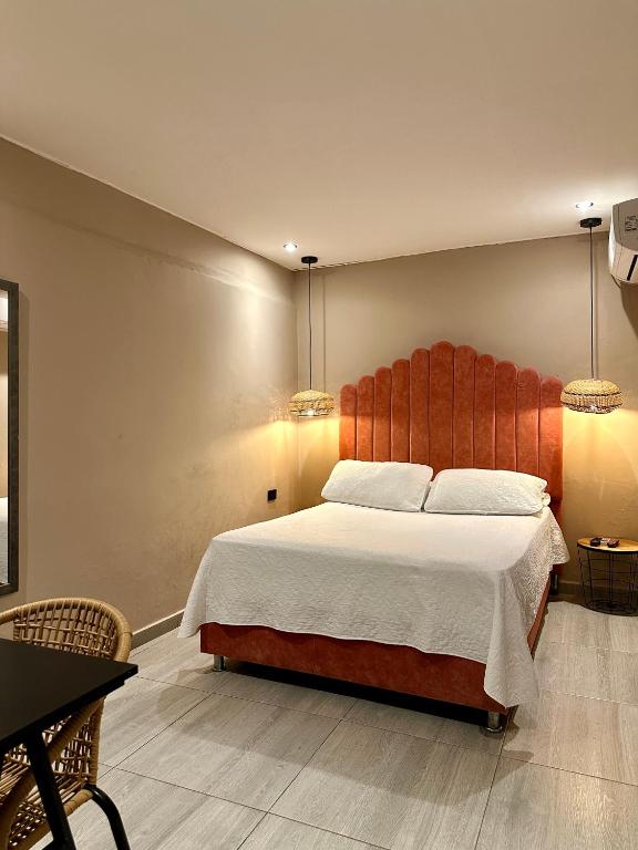Postel nebo postele na pokoji v ubytování Hotel Londres