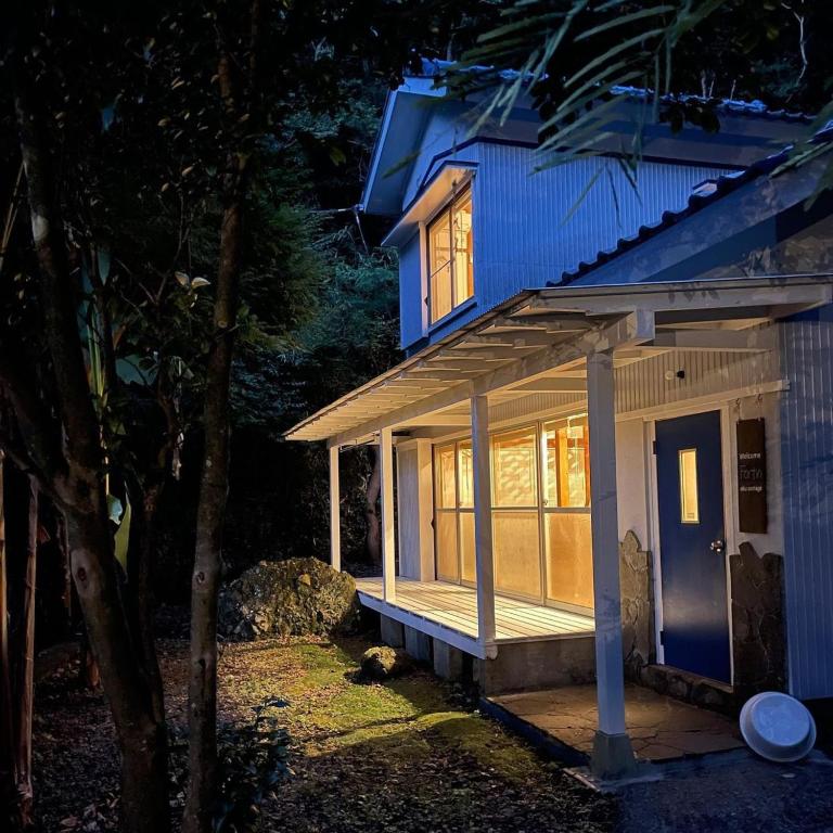 a small blue house with a blue door and windows at Oku Cottage - walk to Ohama Beach - Max 4 ppl in Shimoda