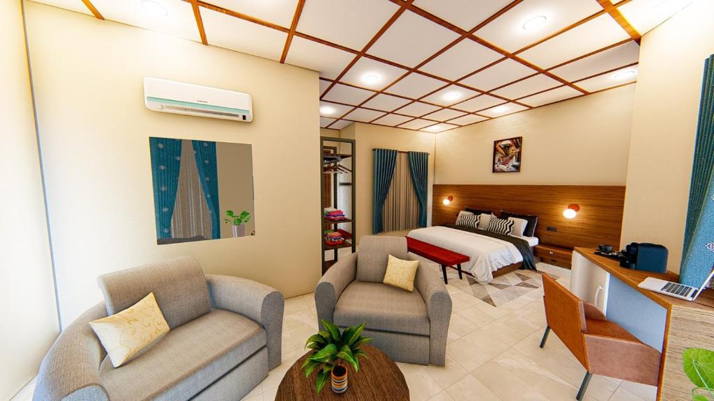 a hotel room with a bed and a living room at Serengeti legacy Lodge in Lukungu