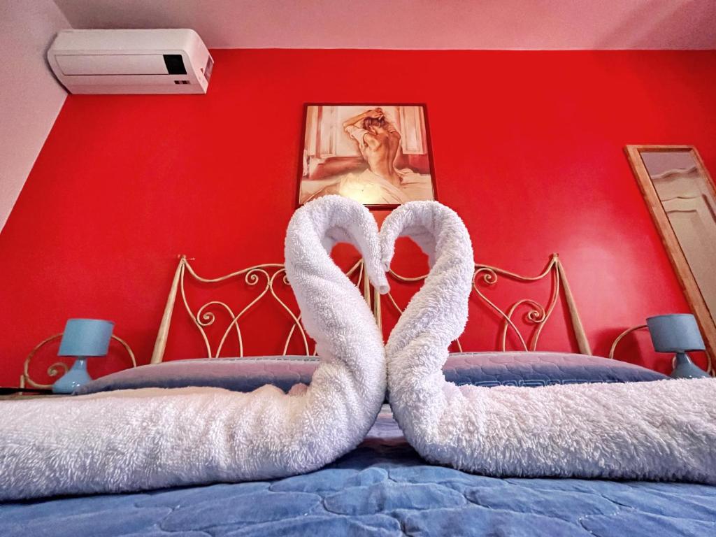 Postel nebo postele na pokoji v ubytování B&B Epos Acitrezza