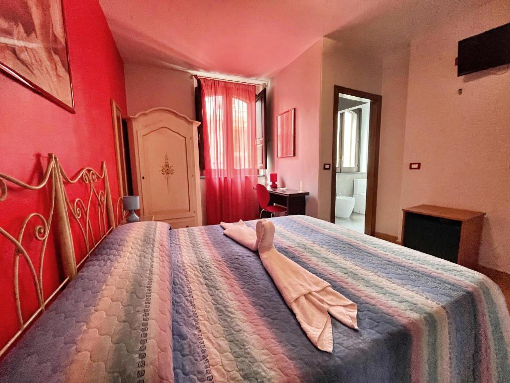 Postel nebo postele na pokoji v ubytování B&B Epos Acitrezza