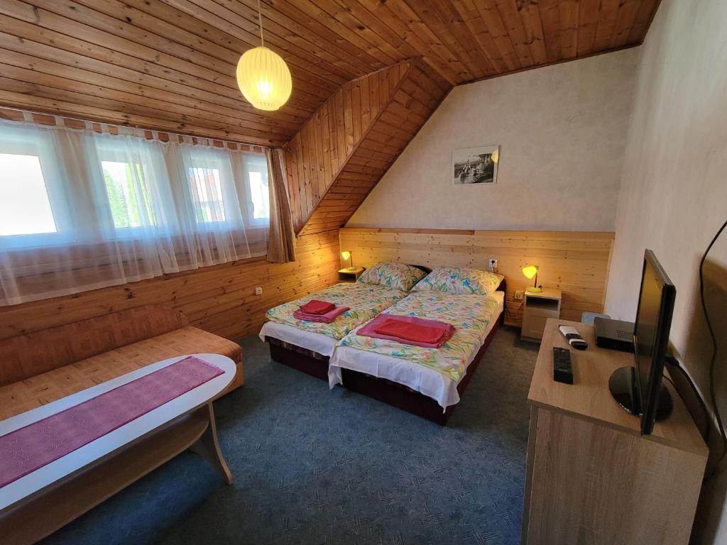 Posteľ alebo postele v izbe v ubytovaní Al Do Apartman