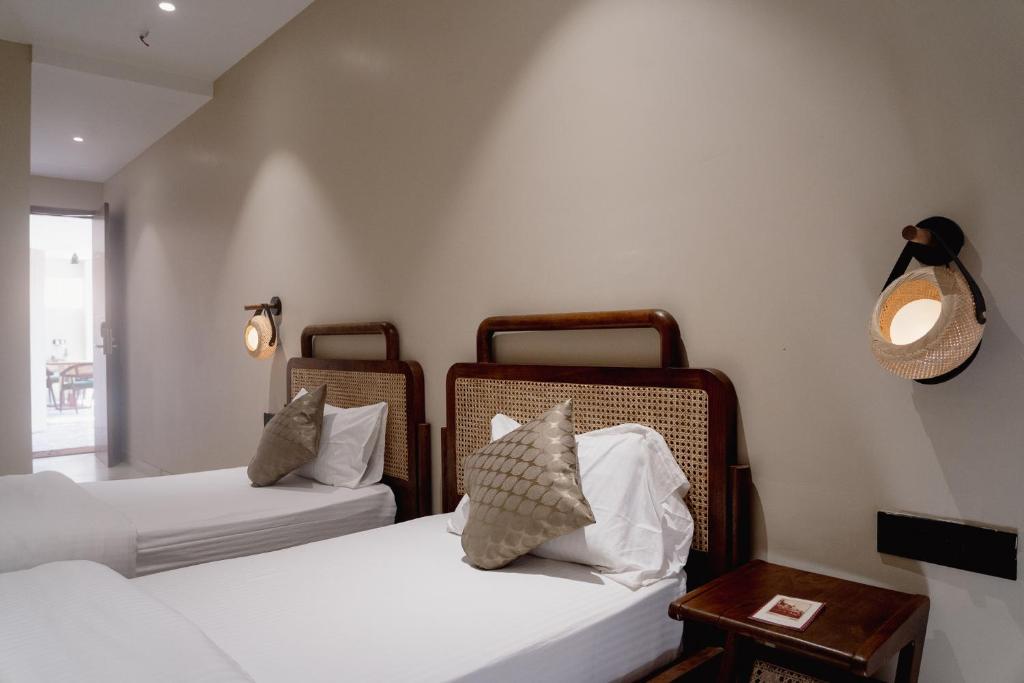 Postel nebo postele na pokoji v ubytování Kaas by Safarnama - Boutique Hotel