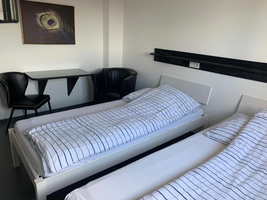 Ein Bett oder Betten in einem Zimmer der Unterkunft Pension Akropolis