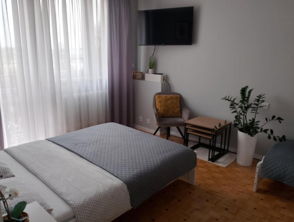 Posteľ alebo postele v izbe v ubytovaní Apartament Alga Zator