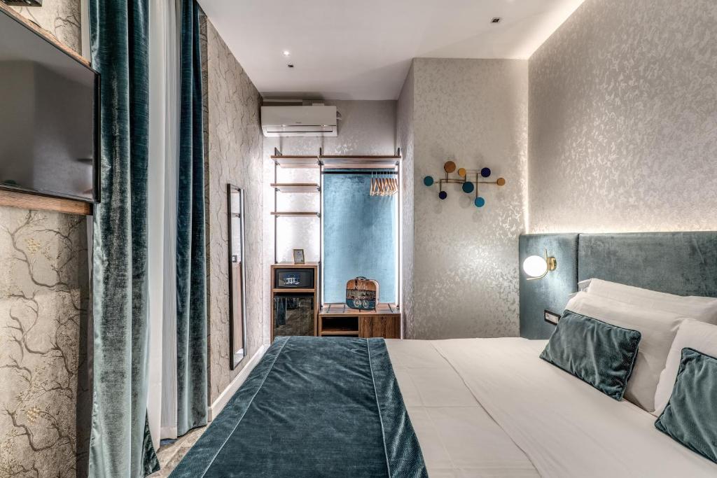 Postel nebo postele na pokoji v ubytování Apollo Boutique Hotel